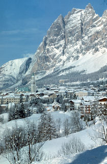 Rock spires of the Dolomite Mountains surround the charming village of Cortina d'Ampezzo, Italy. (photo: Cortina Tourism)