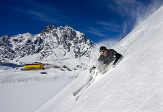 Skier Chris Purcell smiles through deep powder at Chile's Ski Portillo. (photo: Jonathon Selkowitz)