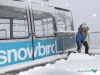 Snowbird's Emily Moench shovels snow from the tram dock atop Hidden Peak (photo: Dave Fields)