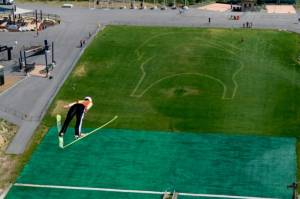 The Backcountry.com Goat logo is depicted in the outrun area as U.S. Ski Jumping athletes train this summer at Utah Olympic Park. (photo: USASJ)