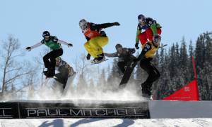 Action during the 5th men's heat at Friday's World Cup Snowboardcross in Telluride, Colo. Pierre Vaultier (FRA) yellow, Stian Sivertzen (NOR) red, Alex Pullin (AUS) blue, Elias Koivumaa (FIN) green, Hanno Douschan (AUT) black, Nikolay Olyunin (RUS) white. (photo: FIS/Oliver Kraus)