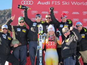 Lindsey Vonn and the U.S. Ski Team coaching staff celebrate after winning the Cortina Trophy for the most successful nation over this weekend's two-race series (photo: Doug Haney/U.S. Ski Team)