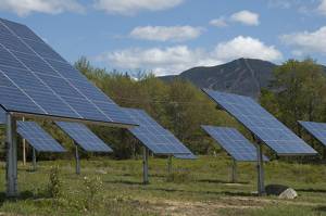 A section of the 35-tracker solar farm at Smugglers' Notch Resort, with the ski trails on Madonna Mountain in the background. (photo: Smugglers' Notch Resort) A section of the 35-tracker solar farm at Smugglers' Notch Resort, with the ski trails on Madonna Mountain in the background. (photo: Smugglers' Notch Resort)