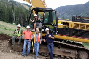 2015 World Championships president Ceil Folz (in cab) celebrates Monday's first day of construction on the new Ladies’ Downhill course at Beaver Creek with Greg Johnson (Men’s Chief of Race), Harry Frampton (2015 Executive Committee), Jim Roberts (Ladies’ Chief of Race) and Tim Baker (Beaver Creek Resort). (photo: VVF)