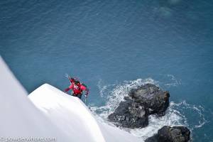 Skiing steeper terrain in Antarctica can require booting up from the watery abyss (climber: Jim Harris; photo: Noah Howell/powderewhore.com)