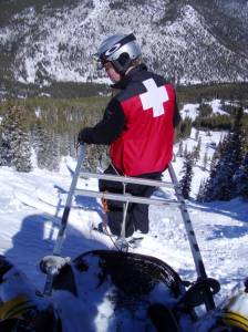 ski patroller with toboggan