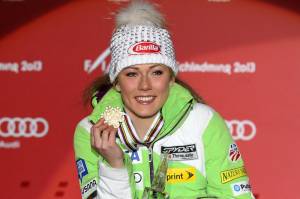 17-year-old  Mikaela Shiffrin, of Eagle, Colo., shows her gold medal earned in Saturday's Alpine FIS Ski World Championships slalom race  in Schladming, Austria. (photo: Mitchell Gunn/ESPA)