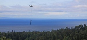 A helicopter flies towers into place on Friday for Lutsen's new six-seat Caribou Express chairlift. (photo: Lutsen Mountains)