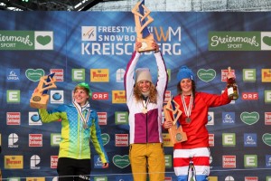 Lindsey Jacobellis, of Stratton Mountain, Vt., celebrates her fourth World Championships snowboardcross gold medal on Friday in Kreischberg, Austria, along with Moenne Loccoz of France, left, and Italy's Michela Moioli, right. (photo: FIS/Oliver Kraus)