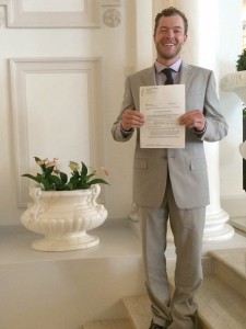 U.S. snowboarder Justin Reiter stands outside a courtroom in Lausanne, Switzerland on Friday holding the court's authorization to proceed with his lawsuit against the International Olympic Committee. (photo courtesy: Justin Reiter)