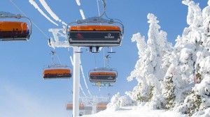 Okemo has retrofitted its Jackson Gore Express Quad with orange bubble chairs for the 2015-16 season. (photo: Okemo Mountain Resort)