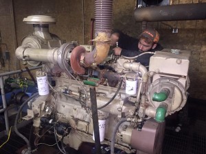 Crews work to repair a seized diesel snowmaking compressor engine as part of Tenney Mountain's rebirth. (photo: Tenney Mountain Facebook)