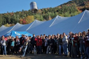 A participant in the annual Attitash Oktoberfest Keg Toss gives it all he's got to throw an empty keg as far as possible. (file photo: Attitash Mountain Resort)