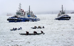 There was a lot more pushing than paddling in the frozen St. Lawrence River during last year’s CMQ Canoe Race, a highlight of Québec City’s Winter Carnival. (Photo: FTO/Martin Griff)