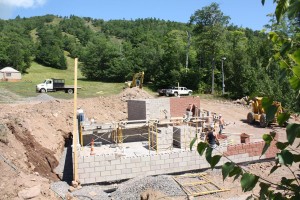 Construction continues on Mount Bohemia's new log cabin bar/hostel. The uptairs will feature a log cabin bar with outdoor hot tub, and the lower level will house a 24-bed hostel. (photo: Mount Bohemia)