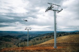 A helicopter places chairlift towers in Powder Mountain's Mary's Bowl. (photo: Powder Mountain)