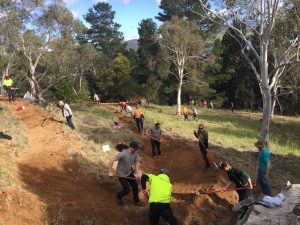 Perisher staff dig in to lend a hand for trail maintenance. (photo: Perisher Resort)