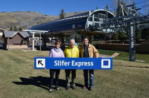 Beth and Rod Slifer receive the Slifer Express trail sign from Chris Jarnot. (photo: Vail Resorts)