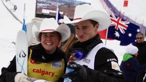 Australians Britteny Cox and Matt Graham get into the Calgary spirit on Saturday. (photo: FIS/Buchholz)