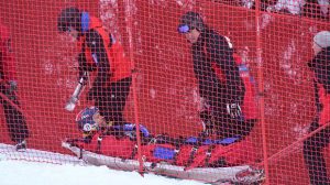 Steven Nyman is taken off the course after his crash at the men downhill race in Garmisch-Partenkirchen, Germany on Friday (photoL Getty Images/AFP-Christof Stache via USSA)