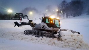 Snow is groomed at dusk in January at the Canaan Valley Resort and Conference Center in Davis, WV. (FTO photo: Martin Griff)