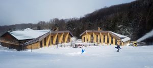 A snowboarder walks from the lodge to the lift at Canaan Valley Resort in Davis, WV. (FTO photo: Martin Griff)