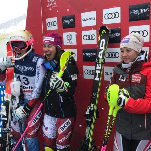 (L to R) Michelle Gisin, Wendy Holdener and Michaela Kirchgasser celebrate in the leader's box at the conclusion of the Women's Super Combined at the 2017 Alpine Ski World Championships in St. Moritz, Switzerland today. (photo: FIS)