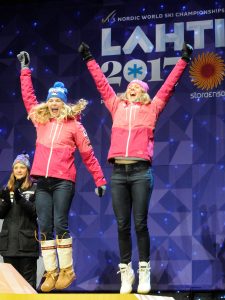 Jessie Diggins and Sadie Bjornsen celebrate their World Championship medal. (photo: U.S. Ski Team/Tom Kelly)