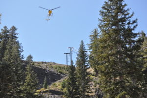 A helicopter assists construction workers building Bear Valley's new high-speed six pack. (photo: Bear Valley Resort)