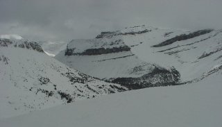 The stratified Canadian Rockies beyond Lake Loo's backside (photo Marc  Guido)