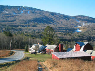 Ribbons of white rise above the bare Vermont landscape at Okemo's opening weekend.