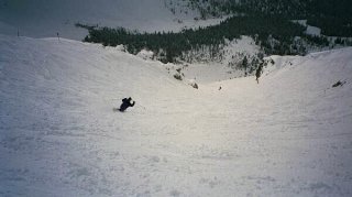 First Tracks!! Online Contributing Writer Dan Barron telemarks he Far Side gully off of Goat's Eye (photo Jim Bauman)