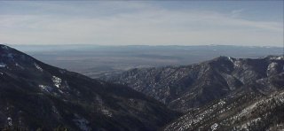 The city of Taos lies in the desert west of the mountain