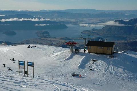 Skiers atop Treble Cone's new Saddle Basin chair look down on New Zealand's Lake Wanaka. (photo: Treble Cone Ski Area)