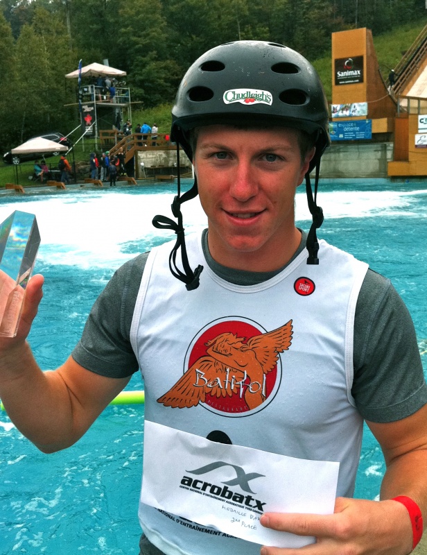 Travis Gerrits, of Milton, Ontario, Canada, shows off his second-place trophy at Sunday's aerials skiing water ramp competition in Lac Beauport, Quebec, Canada. (photo: CFSA)