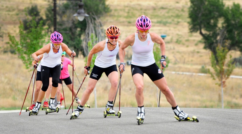 Kikkan Randall, Holly Brooks and Sadie Bjornsen head up a hill during an APU Nordic roller ski camp outside Heber City, Utah, in August. (photo: Tom Kelly)
