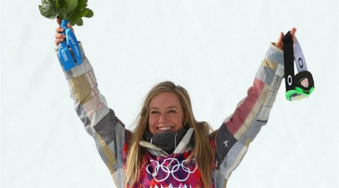 Gold medalist Jamie Anderson of South Lake Tahoe, Calif., celebrates during the flower ceremony for the Women's Snowboard Slopestyle Finals during day 3 of the Sochi 2014 Winter Olympics at Rosa Khutor Extreme Park on Sunday. (photo: Sochi2014)