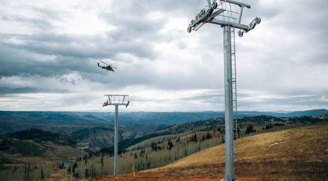 A helicopter places chairlift towers in Powder Mountain's Mary's Bowl. (photo: Powder Mountain)