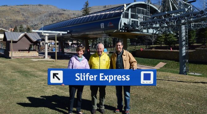 Beth and Rod Slifer receive the Slifer Express trail sign from Chris Jarnot. (photo: Vail Resorts)